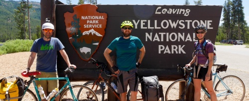 Posing in front of sign